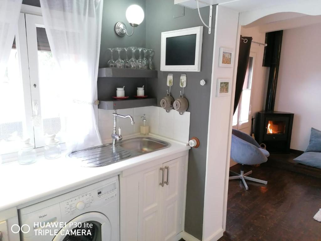 Kuchyňa alebo kuchynka v ubytovaní Casa Rosa Garden House