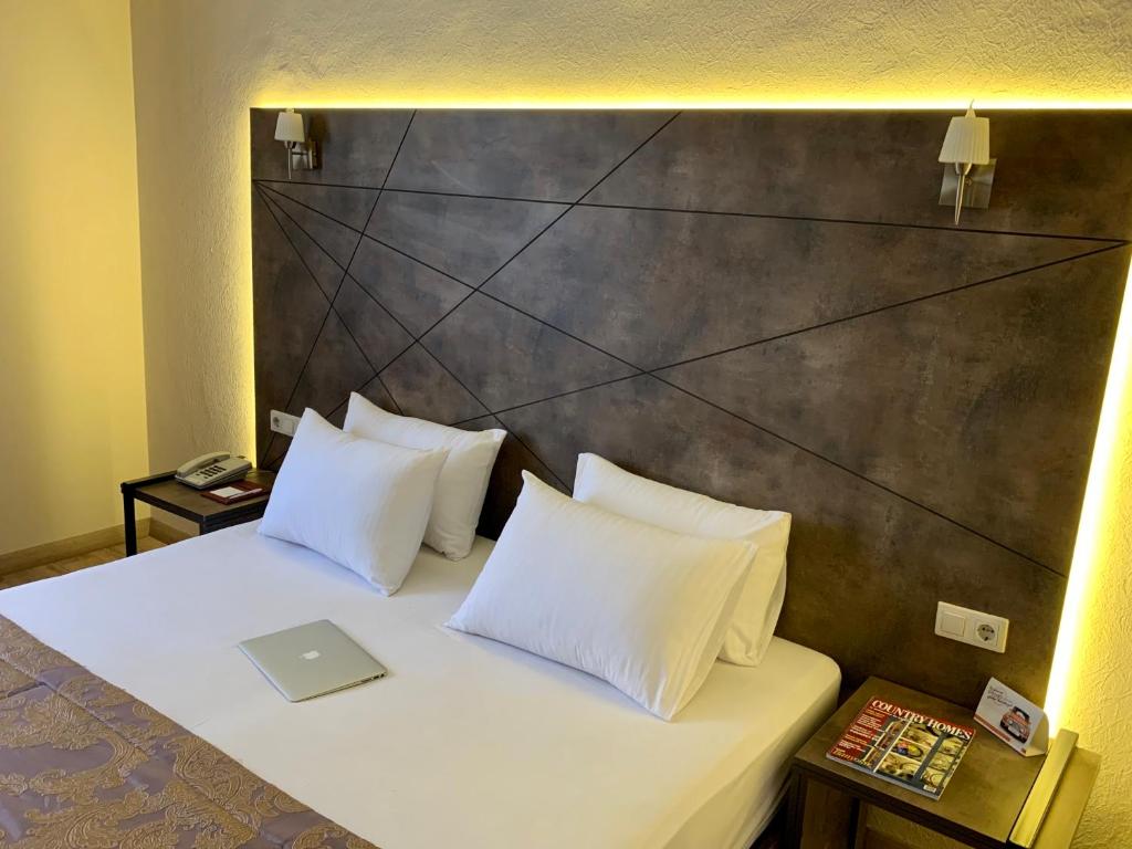Postel nebo postele na pokoji v ubytování Hostapark Hotel