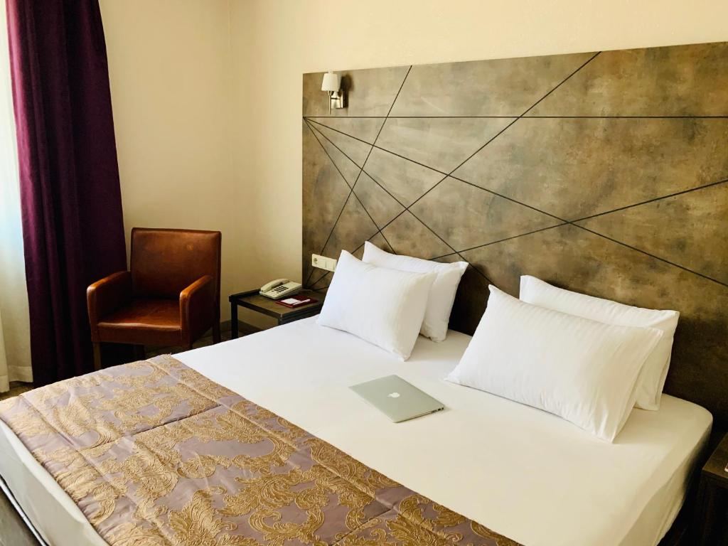 Postel nebo postele na pokoji v ubytování Hostapark Hotel