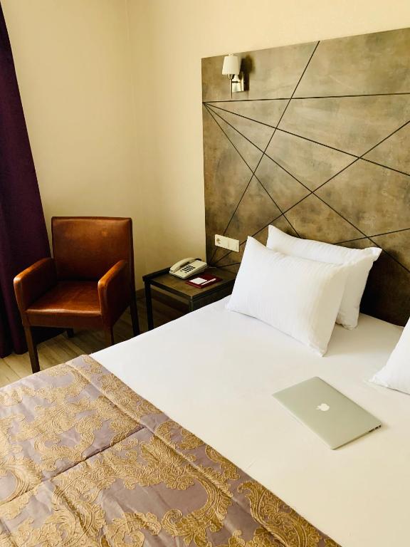 Postel nebo postele na pokoji v ubytování Hostapark Hotel