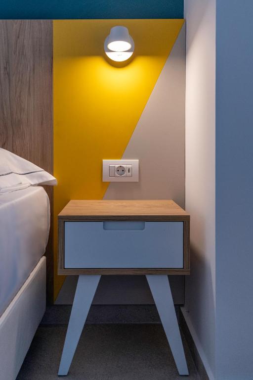 Postel nebo postele na pokoji v ubytování Olympia Hotel