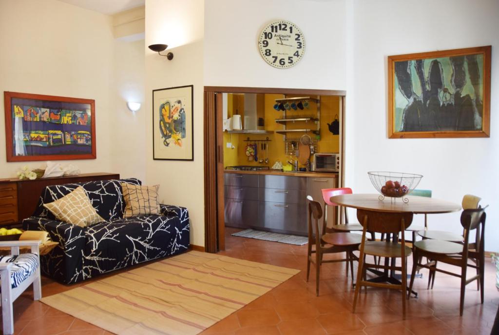 a living room with a couch and a table at Ottavo Portone in Bologna