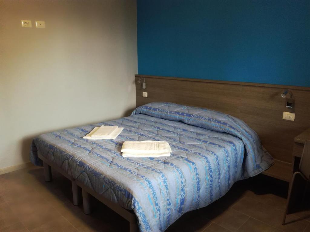 En eller flere senger på et rom på Serafico Guesthouse