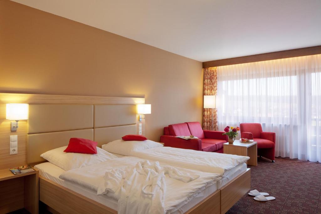Postel nebo postele na pokoji v ubytování Hotel Konradshof