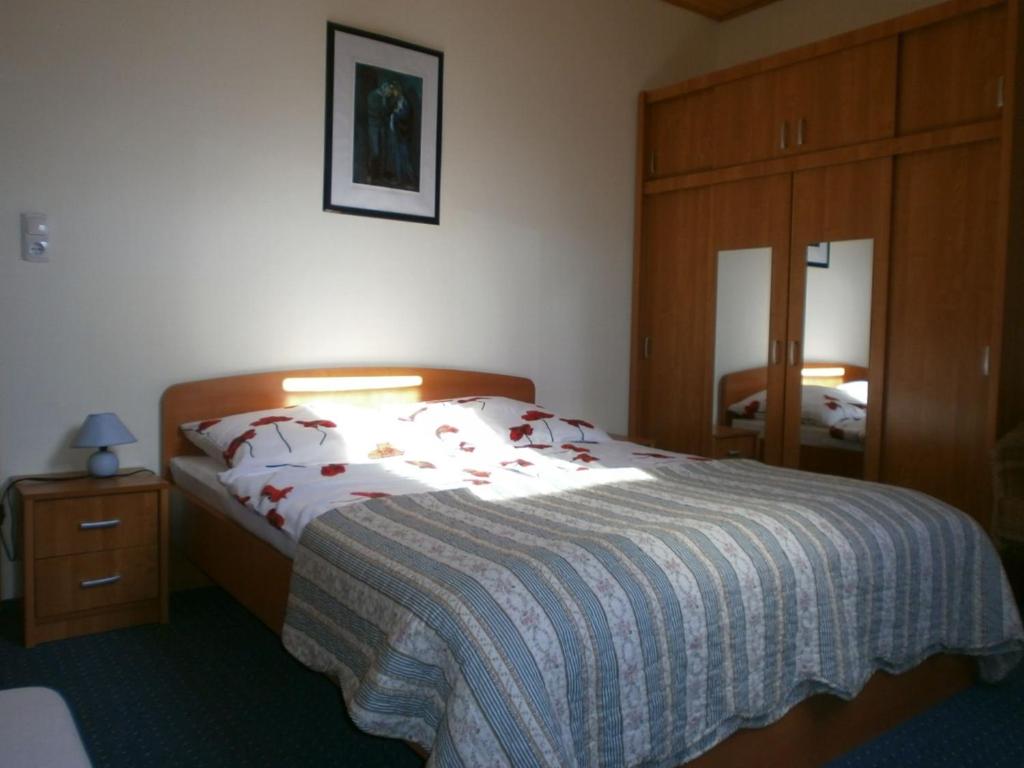 Postel nebo postele na pokoji v ubytování Fehér Rózsa Apartman