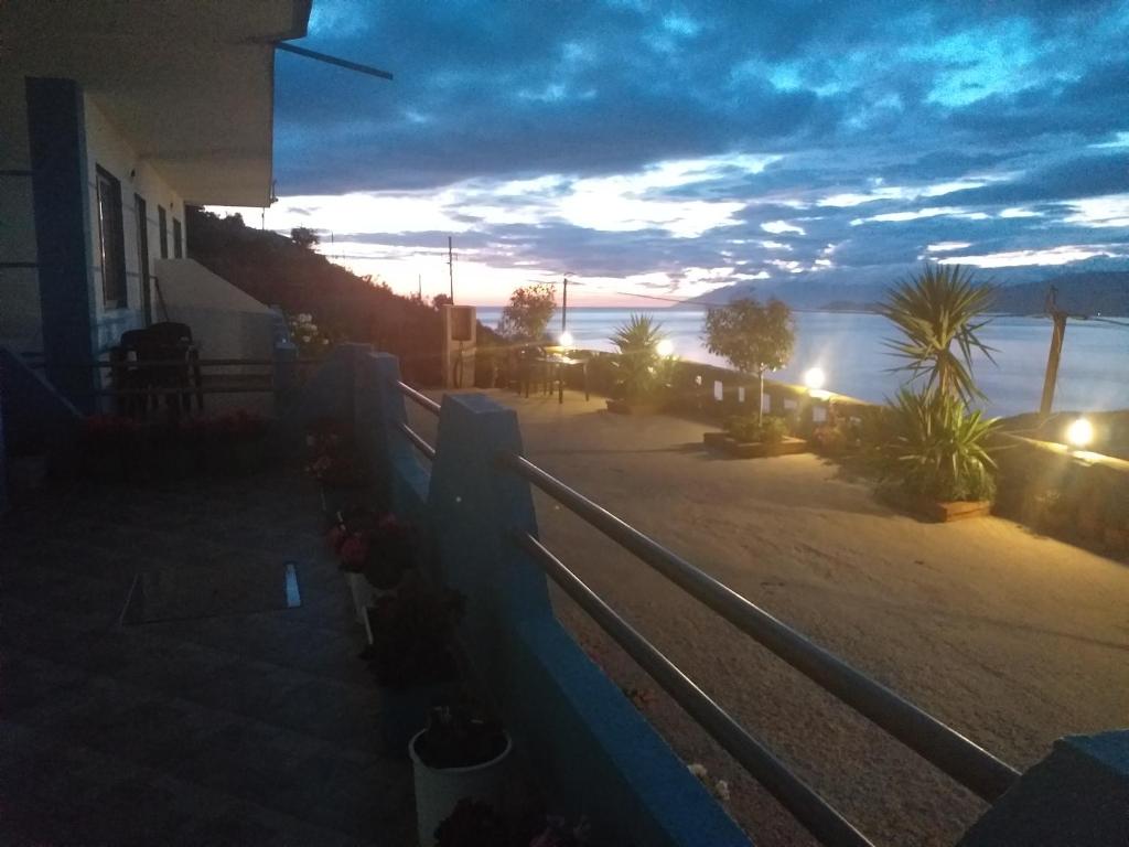 a view of the ocean from a balcony of a house at Grand Seaview Apartments in Ksamil