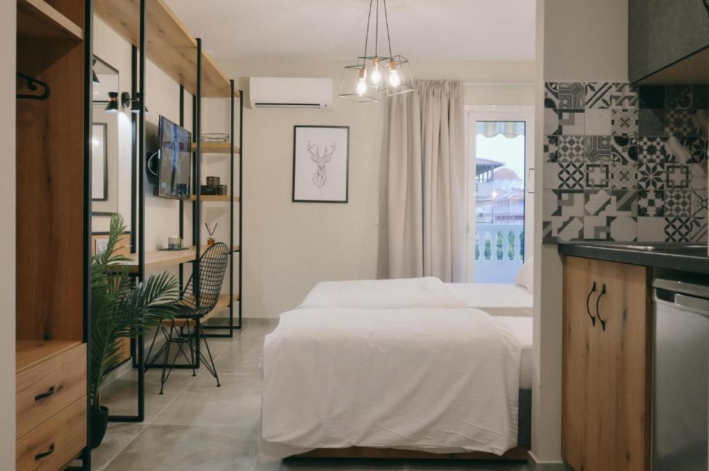 Postel nebo postele na pokoji v ubytování Hotel Hermes Pieria