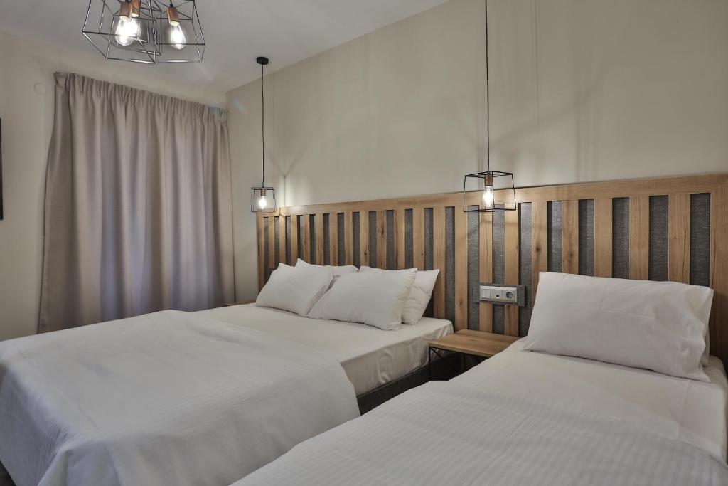 Postel nebo postele na pokoji v ubytování Hotel Hermes Pieria