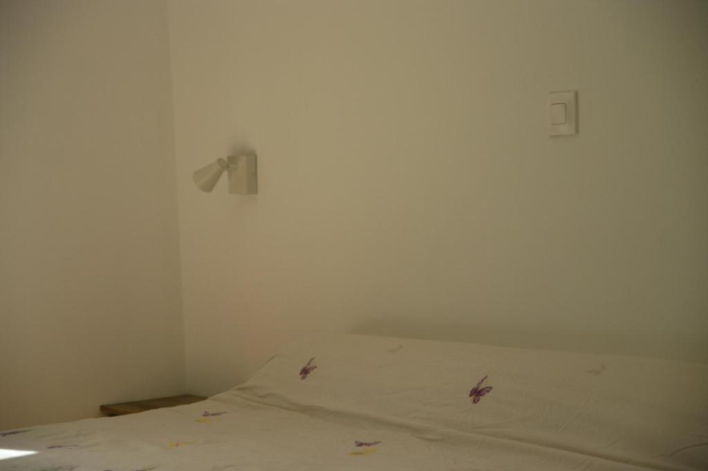Postel nebo postele na pokoji v ubytování Mas De Font Chaude