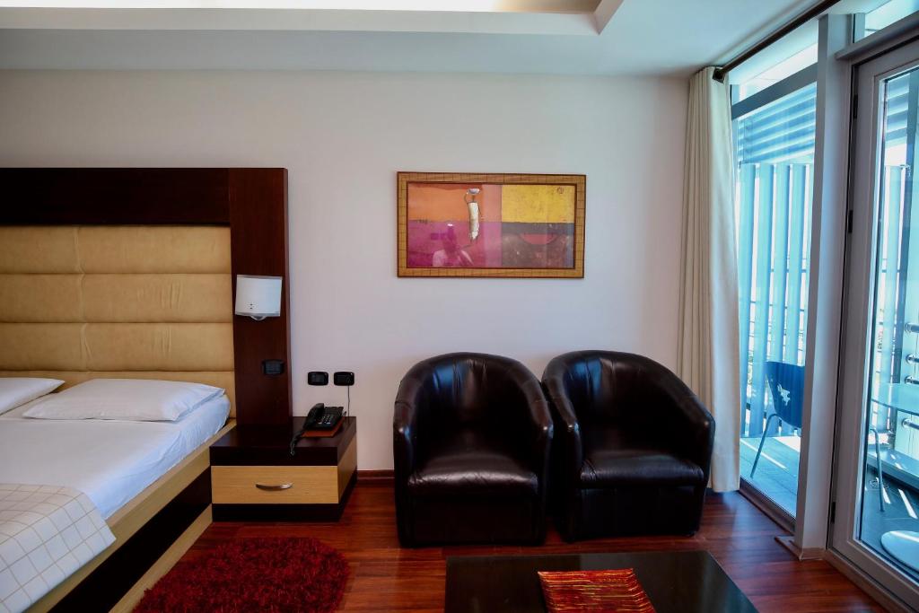 Postel nebo postele na pokoji v ubytování Hotel Vlora International