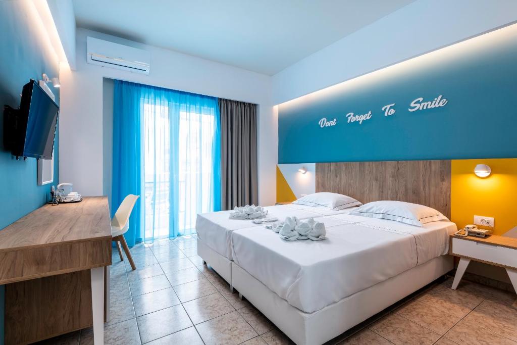 Postel nebo postele na pokoji v ubytování Olympia Hotel