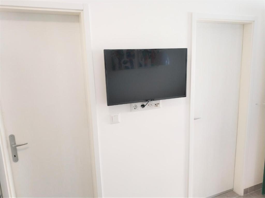 TV a/nebo společenská místnost v ubytování Apartments More