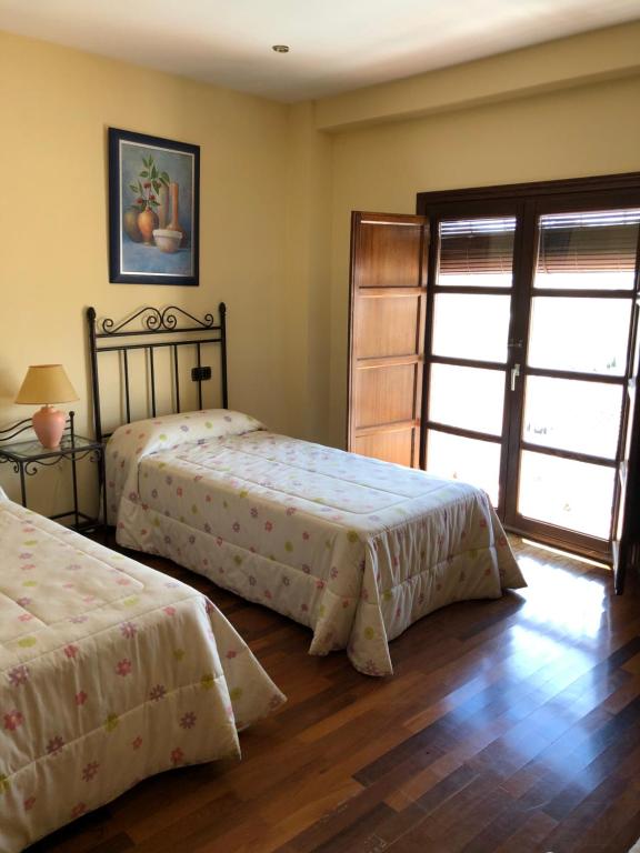 Posteľ alebo postele v izbe v ubytovaní La casa de Tita Elvira 4