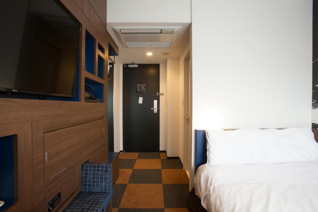 Voodi või voodid majutusasutuse Henn na Hotel Tokyo Haneda toas