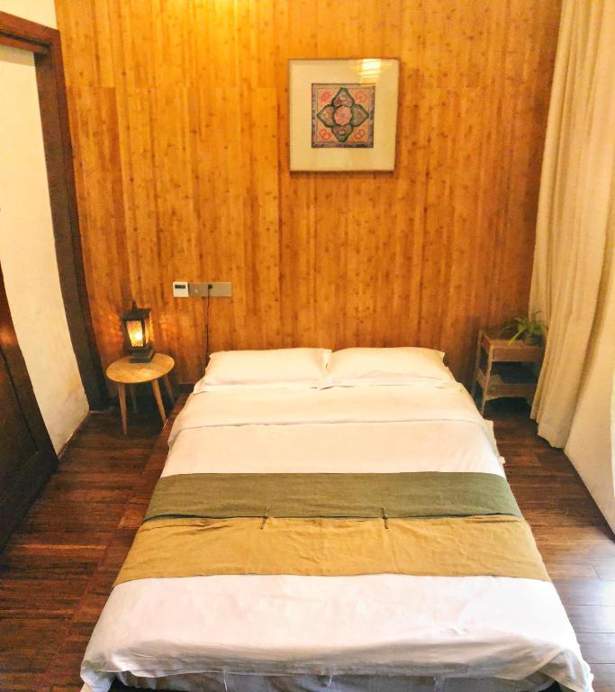 Postel nebo postele na pokoji v ubytování Dan’s Sea Guest House Hangzhou