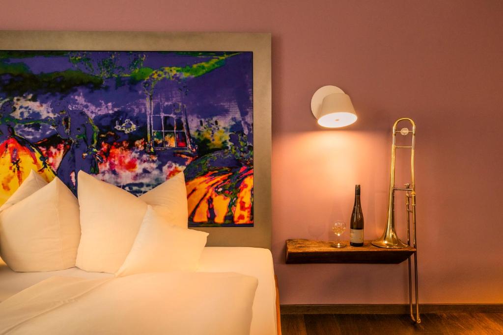 Postel nebo postele na pokoji v ubytování Hotel Münchner Hof und Blauer Turm