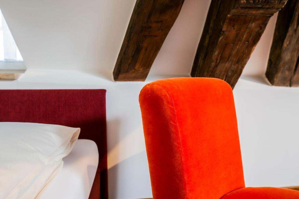 Postel nebo postele na pokoji v ubytování Hotel Münchner Hof und Blauer Turm