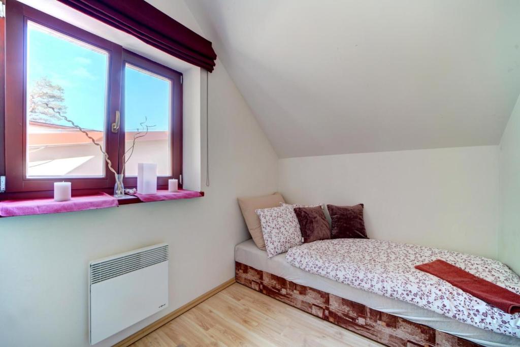Łóżko lub łóżka w pokoju w obiekcie Hotel Zlechov