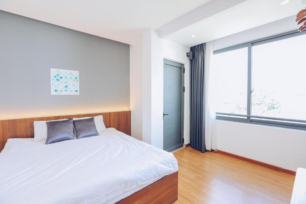 Postel nebo postele na pokoji v ubytování TTR Studio Apart Hotel