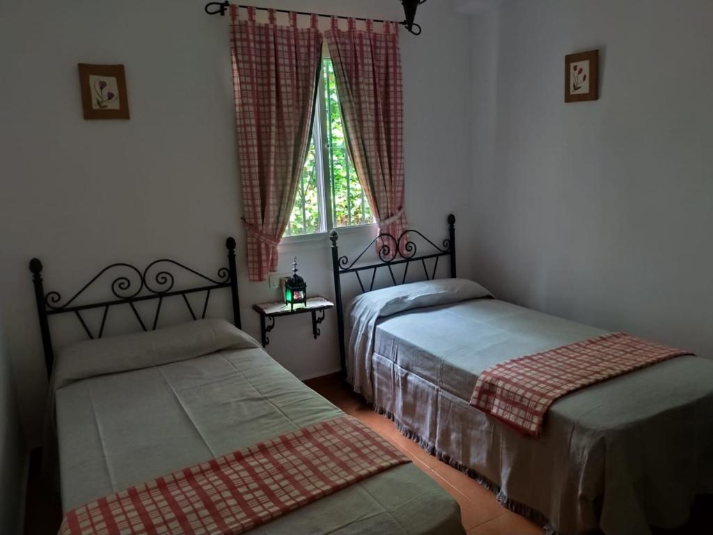 Postel nebo postele na pokoji v ubytování Cortijo la Joya