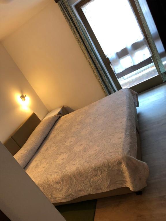Postel nebo postele na pokoji v ubytování Hotel Nevada