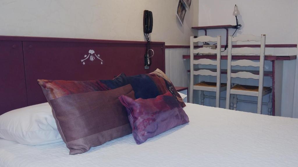 Postel nebo postele na pokoji v ubytování Hotel Mignon
