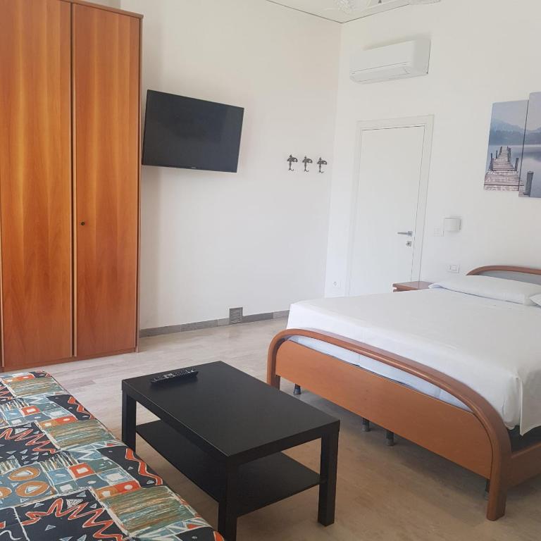 Postel nebo postele na pokoji v ubytování Eagle Rooms