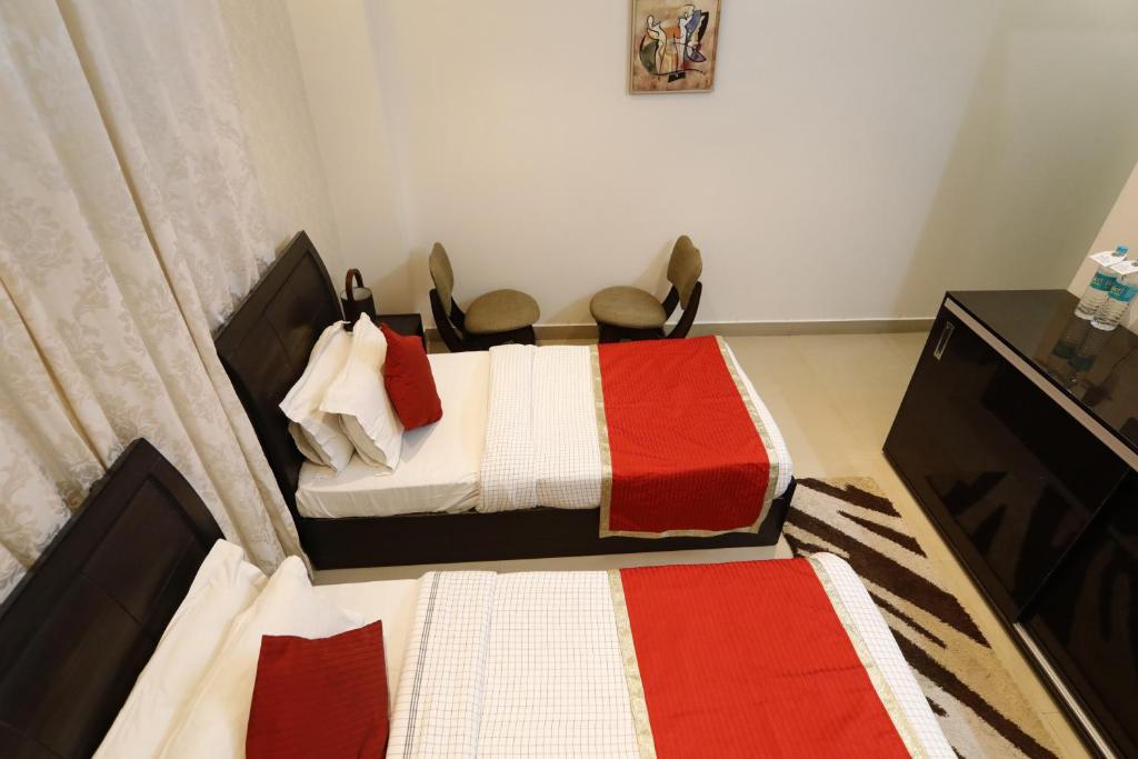 Postel nebo postele na pokoji v ubytování Hotel Yog Vashishth