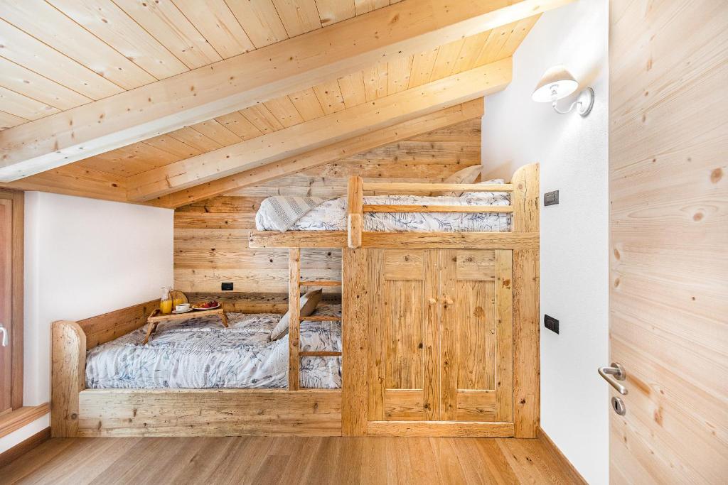 A bed or beds in a room at Chalet Resort Sozzine
