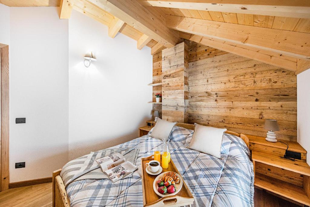 A bed or beds in a room at Chalet Resort Sozzine