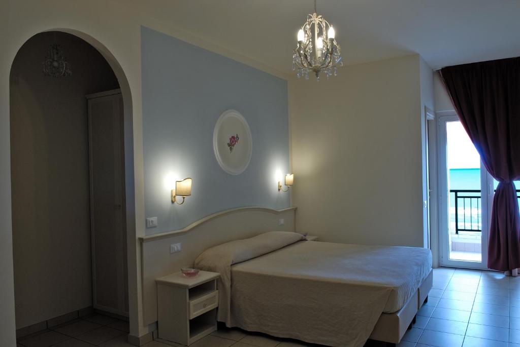 Postel nebo postele na pokoji v ubytování Hotel Cirillo Family Club - All Inclusive
