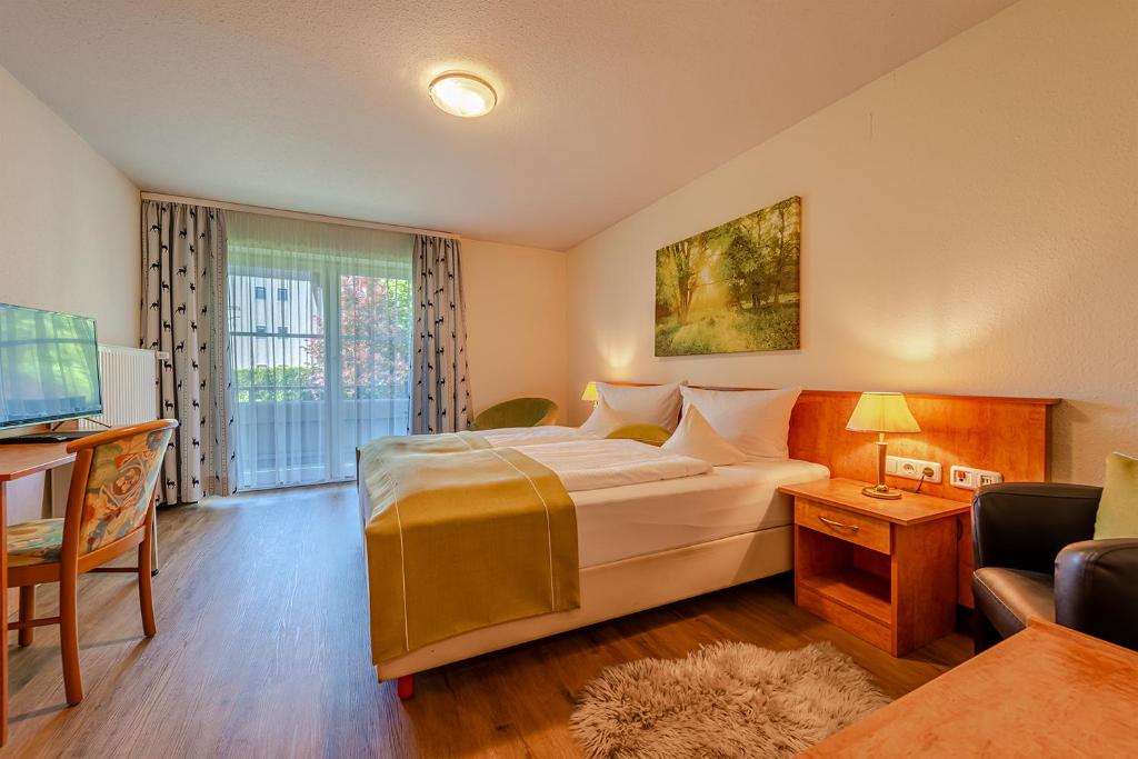 Postel nebo postele na pokoji v ubytování Hotel Neudeck
