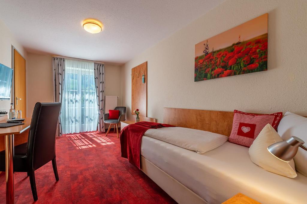 Postel nebo postele na pokoji v ubytování Hotel Neudeck