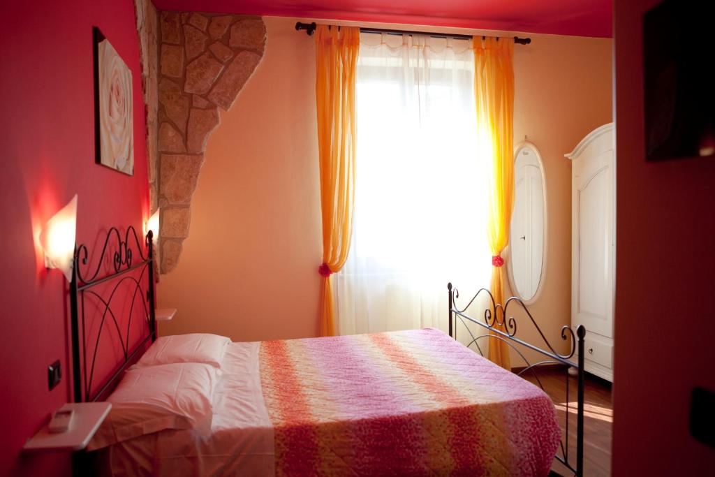 Postel nebo postele na pokoji v ubytování B&B Raffiori