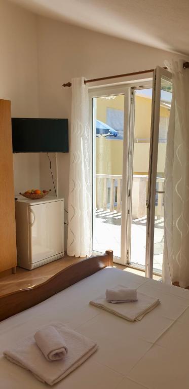 Posteľ alebo postele v izbe v ubytovaní Vila Jela