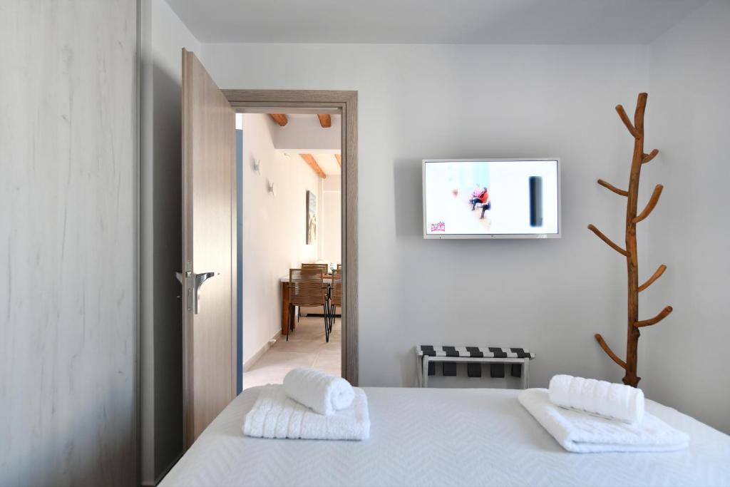 Posteľ alebo postele v izbe v ubytovaní Iresma Suites