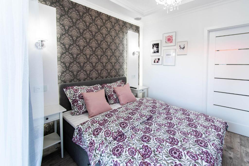 Posteľ alebo postele v izbe v ubytovaní Glam Apartment