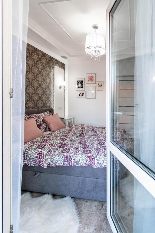 Posteľ alebo postele v izbe v ubytovaní Glam Apartment