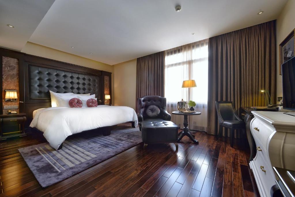Postel nebo postele na pokoji v ubytování Paradise Suites Hotel