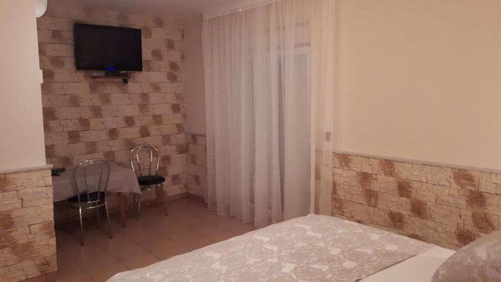 Postel nebo postele na pokoji v ubytování Dalmacija