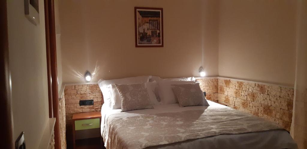 Postel nebo postele na pokoji v ubytování Dalmacija