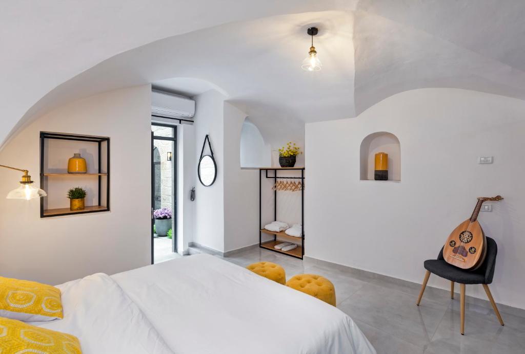 Postel nebo postele na pokoji v ubytování Old City Boutique Hotel