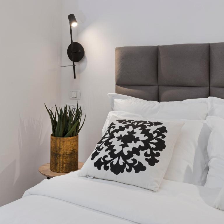 Postel nebo postele na pokoji v ubytování Old City Boutique Hotel