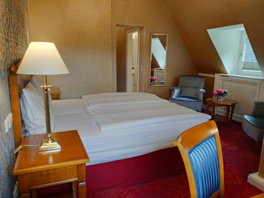 Postel nebo postele na pokoji v ubytování Hotel Erbprinzenpalais