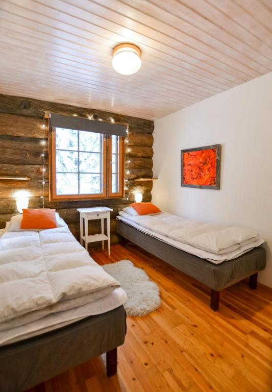 Postel nebo postele na pokoji v ubytování Ylläshilla Cottage