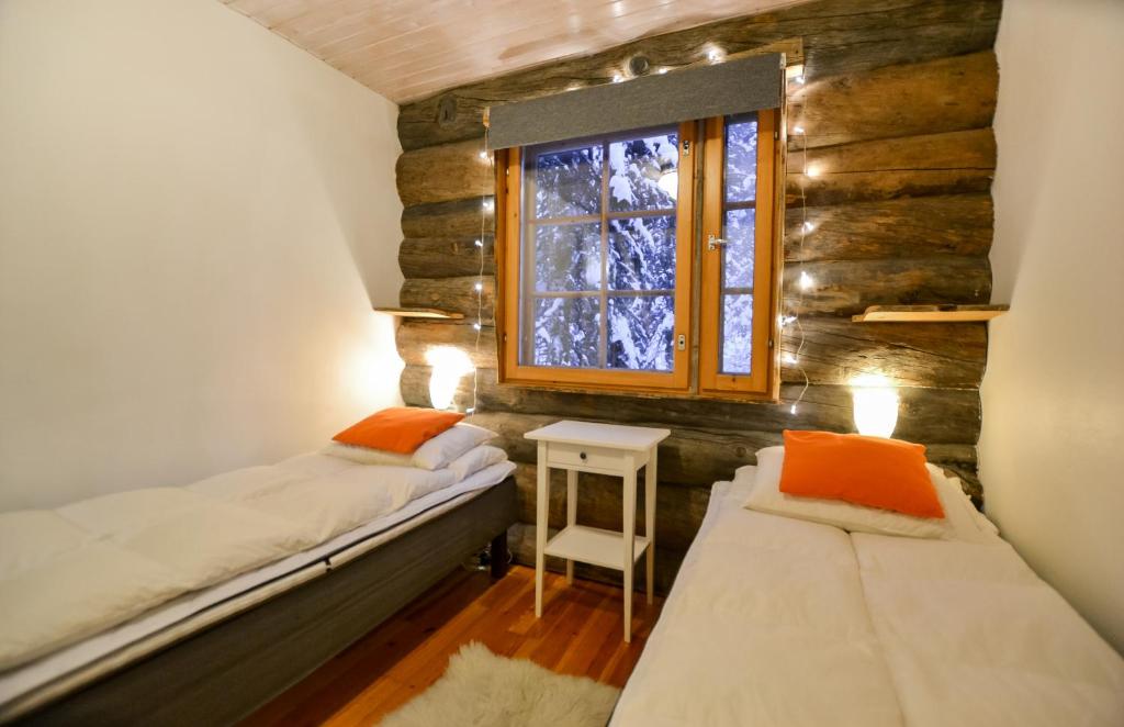 Postel nebo postele na pokoji v ubytování Ylläshilla Cottage