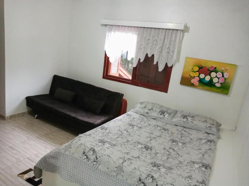 Postel nebo postele na pokoji v ubytování Hospedagem dona Tania
