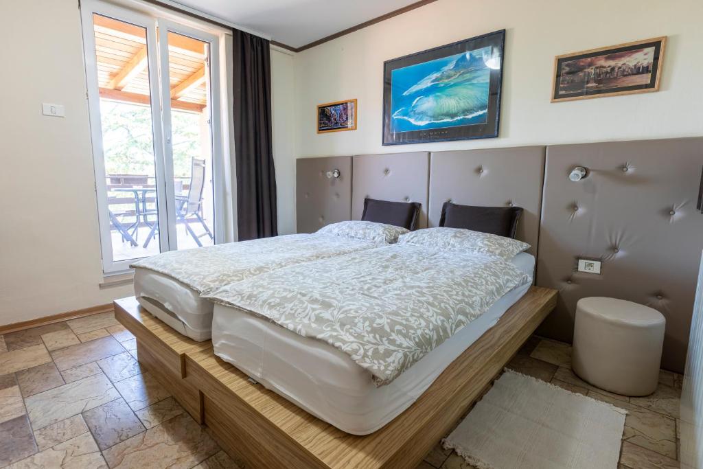 Postel nebo postele na pokoji v ubytování ANGELO