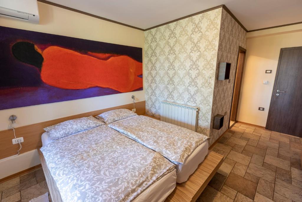 Postel nebo postele na pokoji v ubytování ANGELO