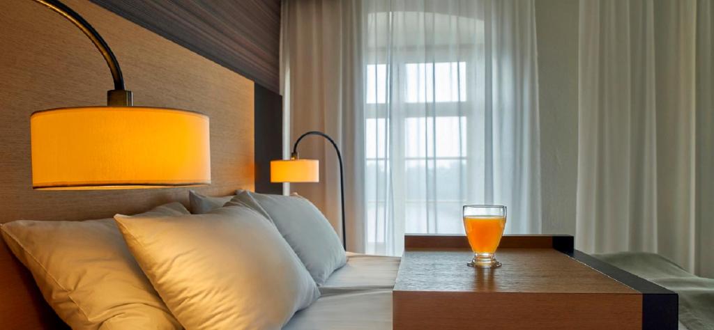Postel nebo postele na pokoji v ubytování Hotel Bulwar